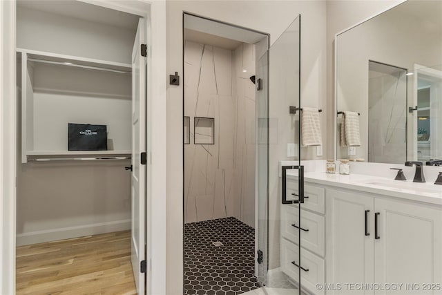4708 S Sequoia Ave, Broken Arrow, OK 74011 - full bathroom with a shower stall, vanity, and wood finished floors