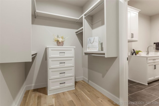 4708 S Sequoia Ave, Broken Arrow, OK 74011 - walk in closet with light wood-style flooring