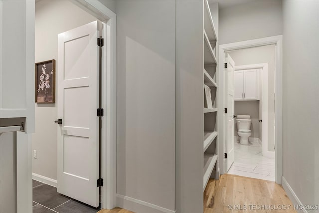 4708 S Sequoia Ave, Broken Arrow, OK 74011 - hallway with baseboards and wood finished floors