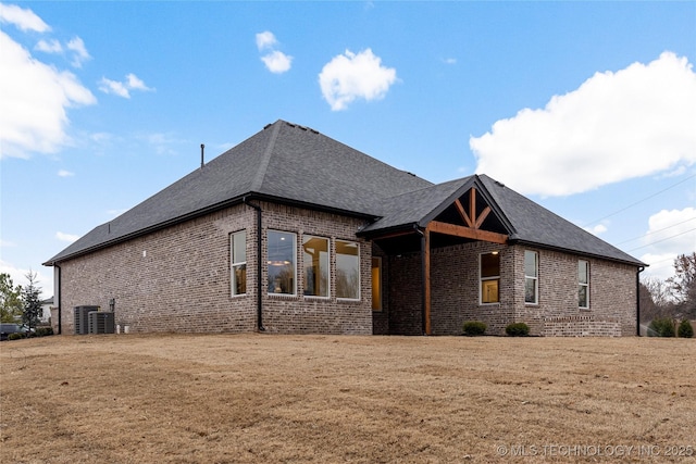 4708 S Sequoia Ave, Broken Arrow, OK 74011 - view of home's exterior featuring brick siding, roof with shingles, and a yard