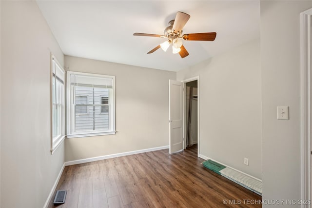 1013 N Main St, Sand Springs, OK 74063 - unfurnished bedroom with wood finished floors and a ceiling fan