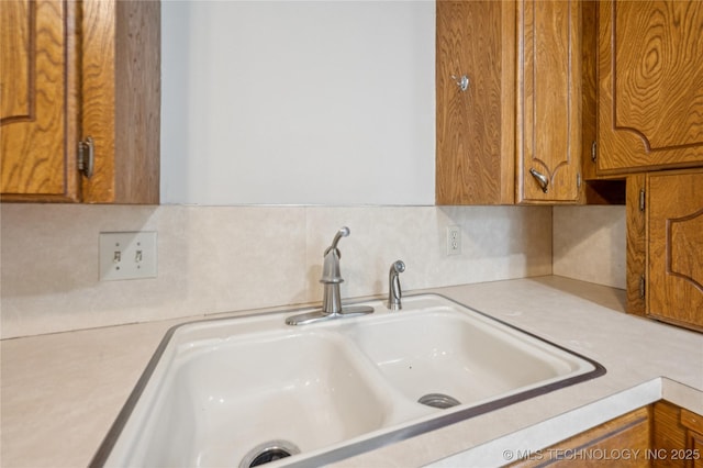 1013 N Main St, Sand Springs, OK 74063 - kitchen view of light countertops, brown cabinets, and backsplash