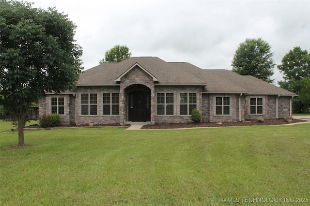2148 E Wise Rd, Mcalester, OK 74501 - view of front of house with a front yard, roof with shingles, and stone siding