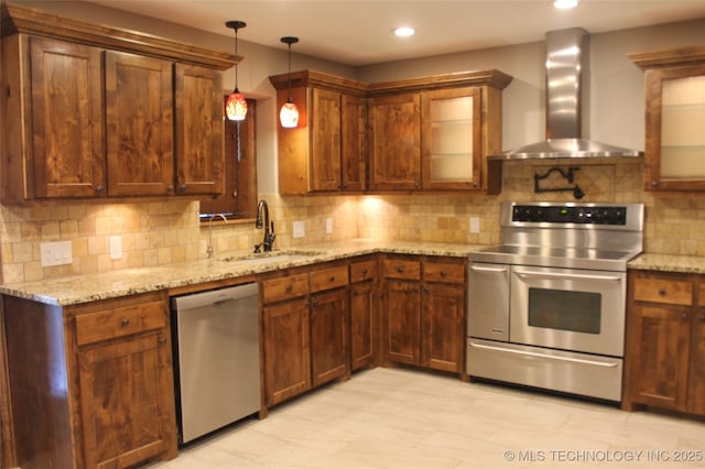 2148 E Wise Rd, Mcalester, OK 74501 - kitchen featuring appliances with stainless steel finishes, wall chimney range hood, light stone counters, backsplash, and recessed lighting