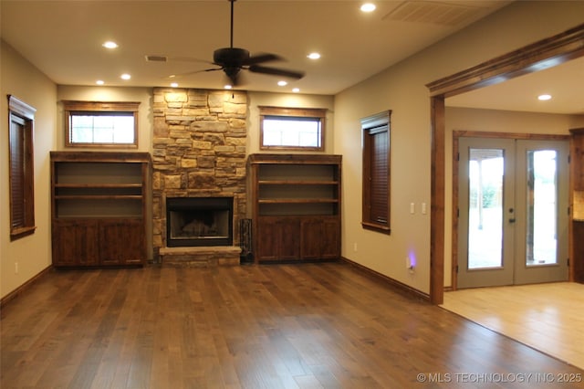 2148 E Wise Rd, Mcalester, OK 74501 - unfurnished living room featuring ceiling fan, a fireplace, wood finished floors, plenty of natural light, and recessed lighting