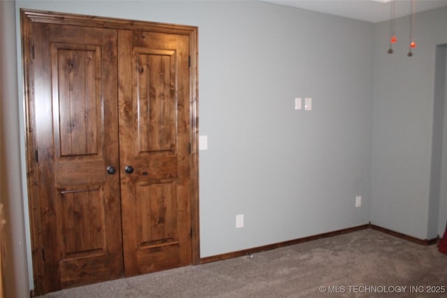 2148 E Wise Rd, Mcalester, OK 74501 - unfurnished bedroom with carpet and baseboards