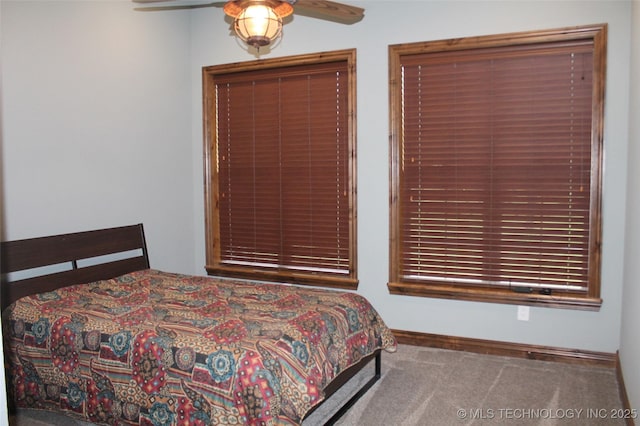 2148 E Wise Rd, Mcalester, OK 74501 - carpeted bedroom with ceiling fan and baseboards