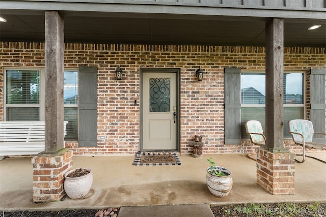 79 Sawyer, Durant, OK 74701 - view of exterior entry with brick siding and a patio