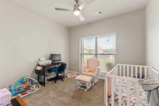 79 Sawyer, Durant, OK 74701 - carpeted bedroom with a ceiling fan and a nursery area