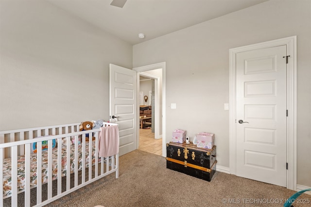 79 Sawyer, Durant, OK 74701 - carpeted bedroom with a nursery area and ceiling fan