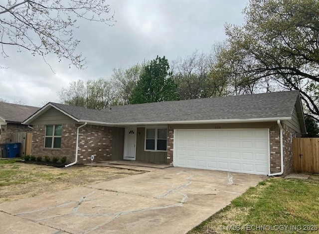 1824 S 119th E Ave, Tulsa, OK 74128 - ranch-style house featuring driveway, a garage, and brick siding