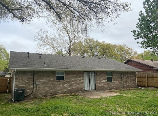1824 S 119th E Ave, Tulsa, OK 74128 - rear view of house with a patio, brick siding, and roof with shingles