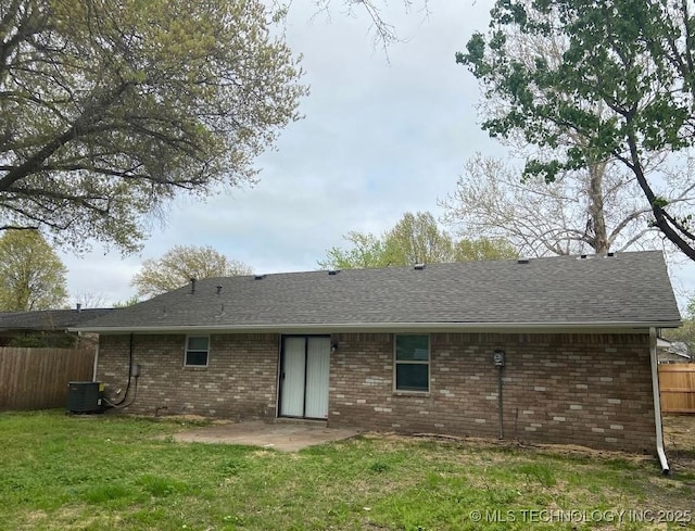 1824 S 119th E Ave, Tulsa, OK 74128 - rear view of property featuring brick siding, a patio, and roof with shingles