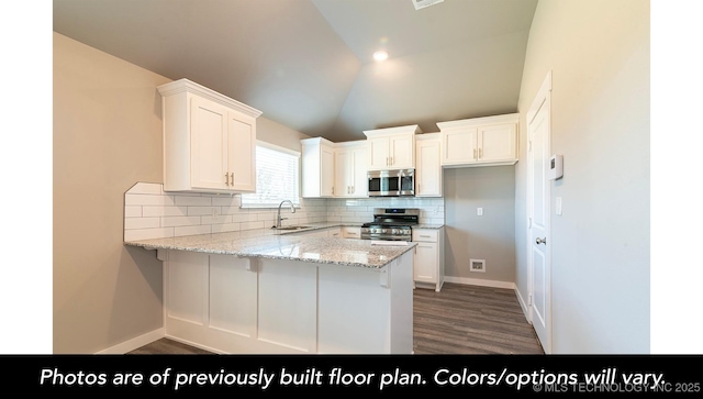 1441 E 149th Pl S, Glenpool, OK 74033 - kitchen with stainless steel appliances, a peninsula, decorative backsplash, white cabinetry, and light stone countertops
