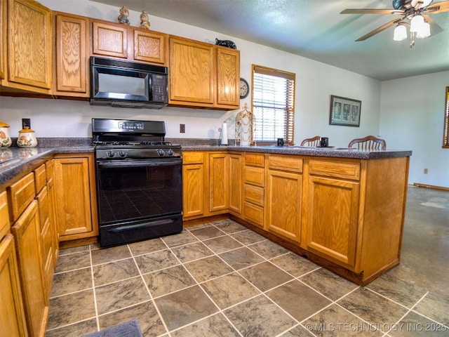 447 Pink Gladiola St, Broken Bow, OK 74745 - kitchen with black appliances, a peninsula, ceiling fan, dark countertops, and brown cabinetry