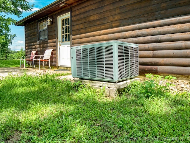 447 Pink Gladiola St, Broken Bow, OK 74745 - exterior view of a central air condition unit and faux log siding