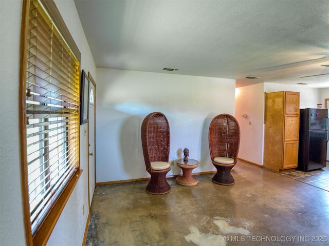 447 Pink Gladiola St, Broken Bow, OK 74745 - interior space with finished concrete flooring and a textured ceiling