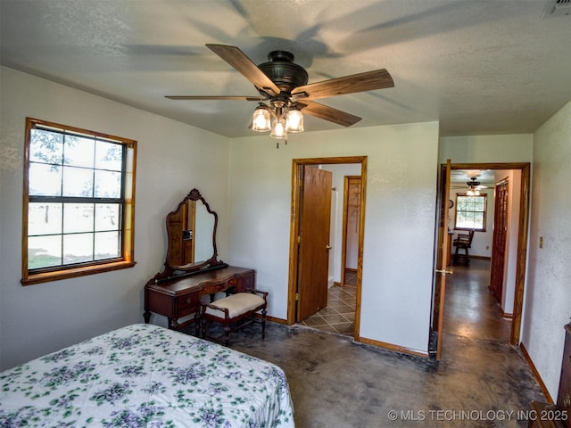 447 Pink Gladiola St, Broken Bow, OK 74745 - bedroom with baseboards and ceiling fan