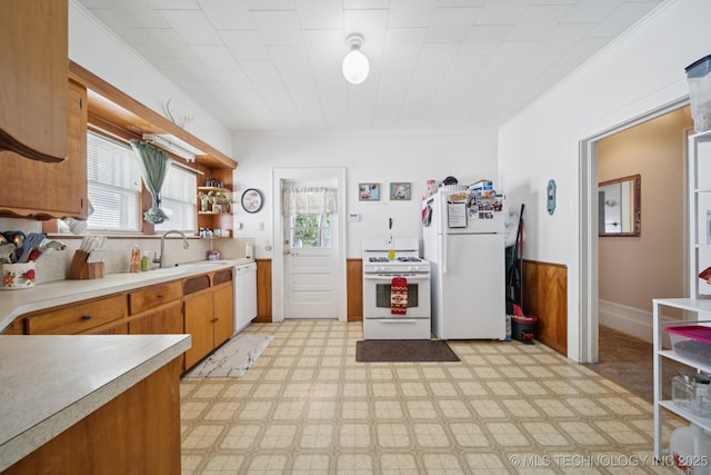 805 W Gentry St, Henryetta, OK 74437 - kitchen featuring white appliances, light countertops, light floors, open shelves, and brown cabinets