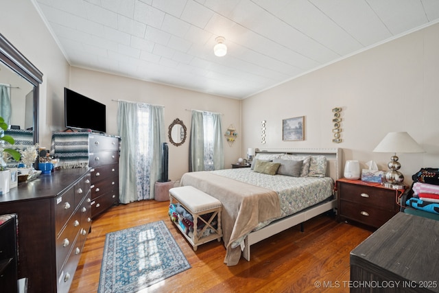 805 W Gentry St, Henryetta, OK 74437 - bedroom featuring crown molding and wood finished floors