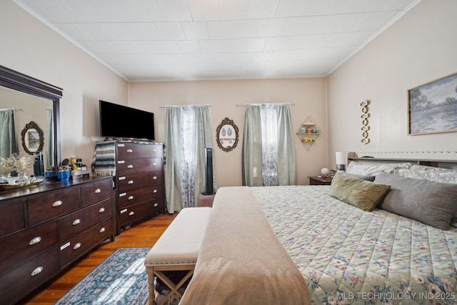 805 W Gentry St, Henryetta, OK 74437 - bedroom featuring crown molding and wood finished floors