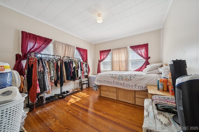 805 W Gentry St, Henryetta, OK 74437 - bedroom featuring wood finished floors and ornamental molding