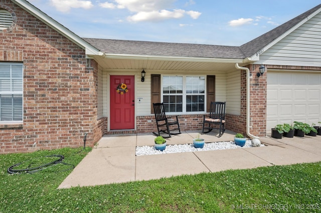 8661 S 264th E Ave, Broken Arrow, OK 74014 - property entrance with brick siding, covered porch, a shingled roof, and a garage