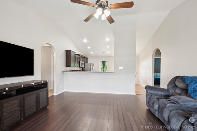 8661 S 264th E Ave, Broken Arrow, OK 74014 - unfurnished living room with arched walkways, lofted ceiling, a ceiling fan, dark wood finished floors, and recessed lighting