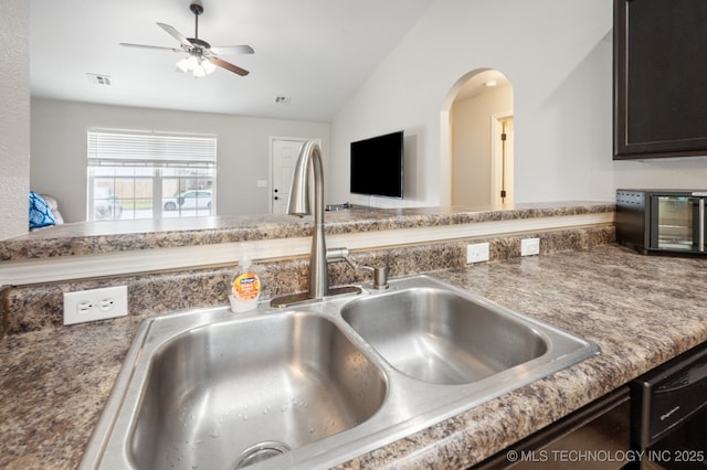 8661 S 264th E Ave, Broken Arrow, OK 74014 - kitchen view of ceiling fan, dishwasher, and dark brown cabinetry