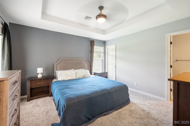 8661 S 264th E Ave, Broken Arrow, OK 74014 - bedroom with a raised ceiling, light carpet, and ceiling fan