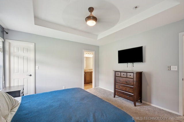 8661 S 264th E Ave, Broken Arrow, OK 74014 - bedroom with light colored carpet, a raised ceiling, ensuite bathroom, and ceiling fan