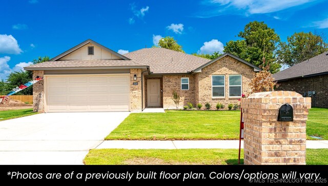 219 S 25th St, Collinsville, OK 74021 - single story home featuring a garage, concrete driveway, roof with shingles, a front yard, and brick siding