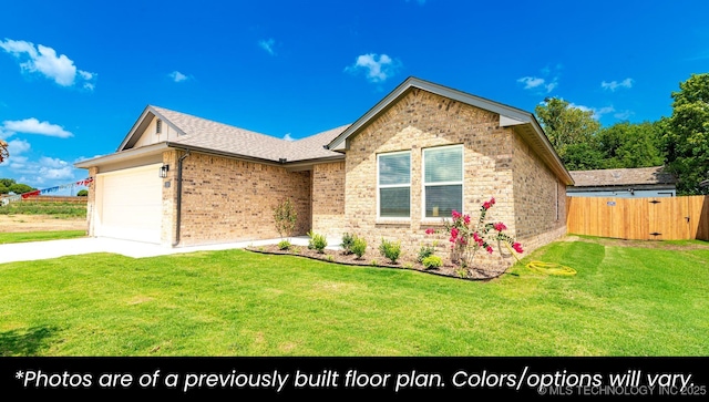 219 S 25th St, Collinsville, OK 74021 - ranch-style house featuring brick siding, an attached garage, and driveway