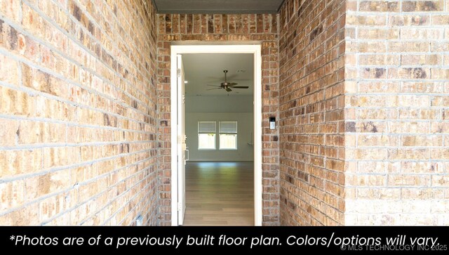 219 S 25th St, Collinsville, OK 74021 - property entrance featuring brick siding