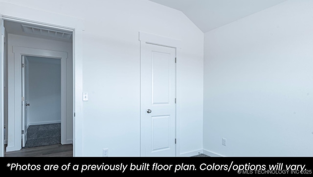 219 S 25th St, Collinsville, OK 74021 - unfurnished bedroom featuring vaulted ceiling and wood finished floors