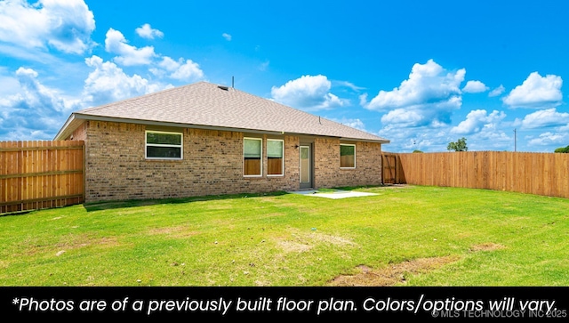 219 S 25th St, Collinsville, OK 74021 - back of house featuring brick siding, a fenced backyard, and a shingled roof