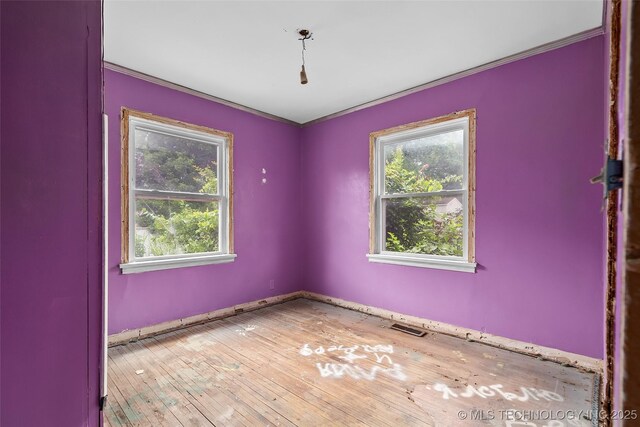 917 N Knoxville Ave, Tulsa, OK 74115 - empty room featuring crown molding and hardwood / wood-style floors