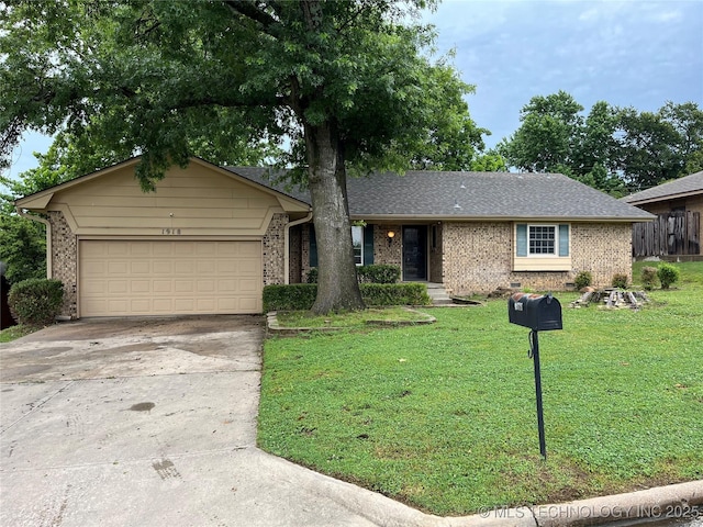 1918 E 14th, Ada, OK 74820 - ranch-style home featuring driveway, brick siding, a front yard, and an attached garage