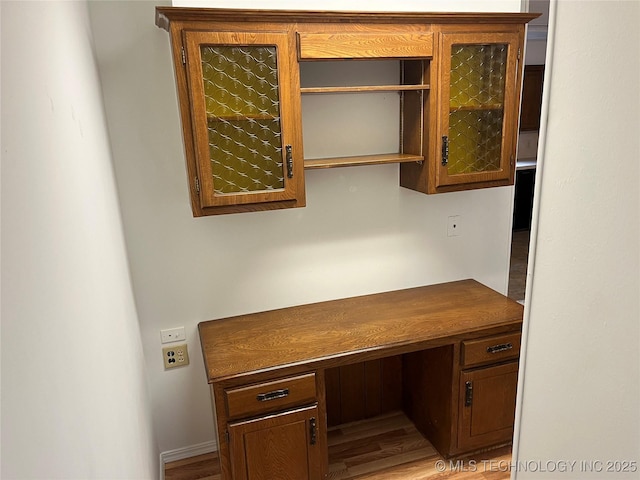 1918 E 14th, Ada, OK 74820 - unfurnished office featuring built in desk and wood finished floors