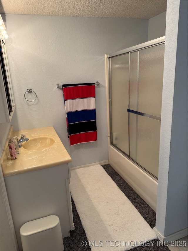 450779 E 341st Rd Unit 34, Afton, OK 74331 - bathroom featuring vanity, enclosed tub / shower combo, and a textured ceiling