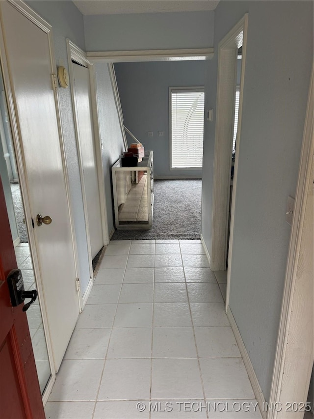 450779 E 341st Rd Unit 34, Afton, OK 74331 - hallway featuring light tile patterned floors