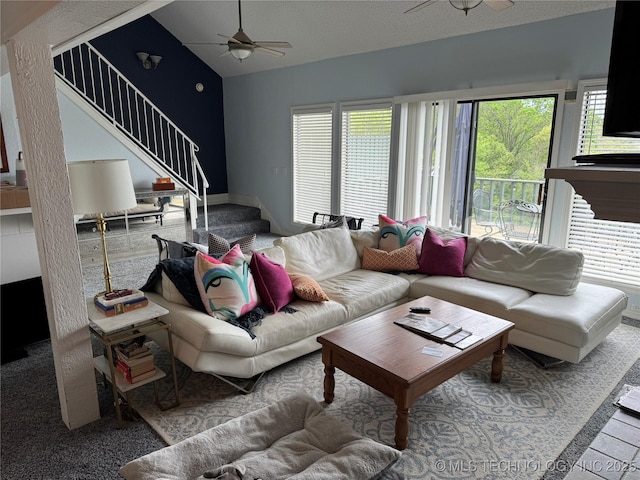 450779 E 341st Rd Unit 34, Afton, OK 74331 - living area with stairs, a ceiling fan, and vaulted ceiling
