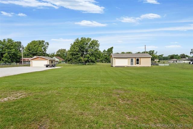 13514 N 97th E Ave, Collinsville, OK 74021 - view of yard featuring an outbuilding, driveway, and a detached garage
