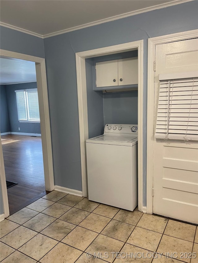 204 E 46th St, Tulsa, OK 74105 - laundry room with washer / dryer, cabinet space, crown molding, and light tile patterned flooring