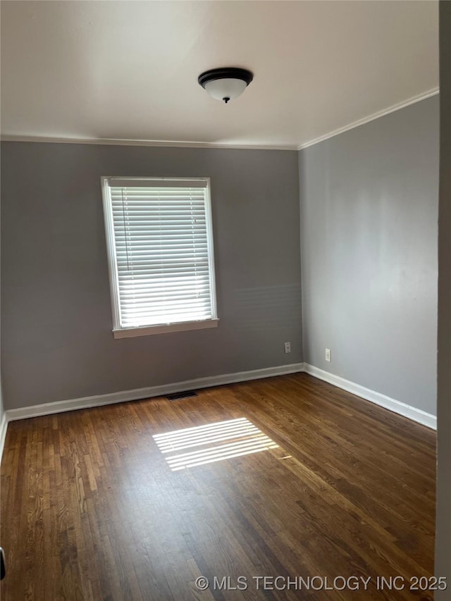 204 E 46th St, Tulsa, OK 74105 - unfurnished room featuring ornamental molding and wood finished floors