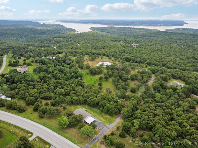 4127 New Prue Rd, Sand Springs, OK 74063 - drone / aerial view of a heavily wooded area and a nearby body of water
