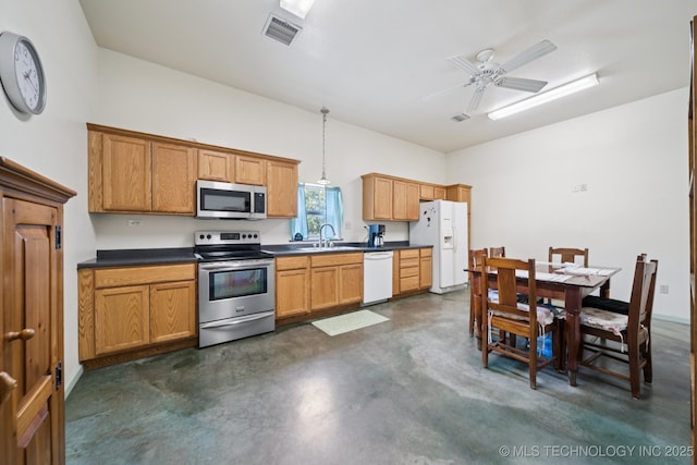 4127 New Prue Rd, Sand Springs, OK 74063 - kitchen with appliances with stainless steel finishes, concrete flooring, dark countertops, and a ceiling fan