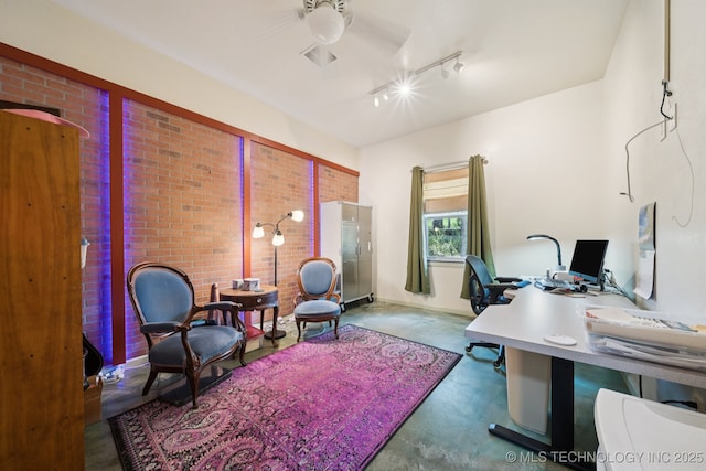 4127 New Prue Rd, Sand Springs, OK 74063 - home office with track lighting, concrete floors, a ceiling fan, and brick wall