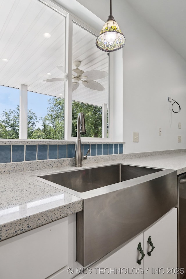 4127 New Prue Rd, Sand Springs, OK 74063 - kitchen view of pendant lighting, light stone countertops, ceiling fan, and stainless steel dishwasher