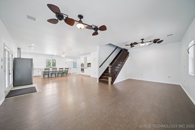 4127 New Prue Rd, Sand Springs, OK 74063 - unfurnished living room with a ceiling fan, stairs, wood finished floors, and recessed lighting